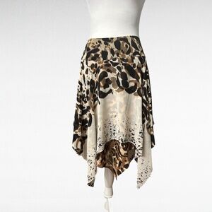 Bebe Scarf Skirt with Snazzy Handkerchief Hemline. Brown, black, cream print